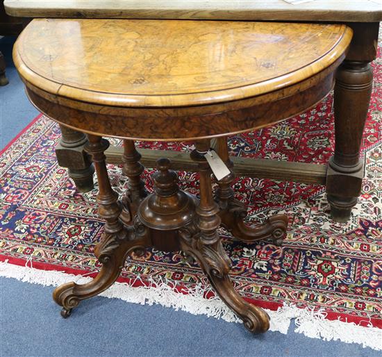 A Victorian walnut demi lune card table W.93cm